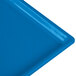 A close-up of a Tablecraft sky blue cast aluminum rectangular cooling platter with a blue surface.