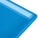 A Tablecraft sky blue cast aluminum rectangular cooling platter with a light blue rim.