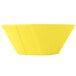 A yellow Tablecraft round cast aluminum serving bowl.