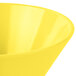 A close up of a Tablecraft yellow round serving bowl.