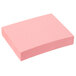 A pink Redi-Tag self-stick note pad.