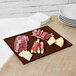 A Tablecraft brown cast aluminum rectangular cooling platter with meat and cheese on it.