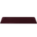 A dark red rectangular cast aluminum platter with a speckled finish.