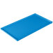 A sky blue rectangular cast aluminum cooling platter on a table.