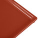 A red Tablecraft copper cast aluminum third size rectangular cooling platter.
