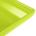A close-up of a lime green Tablecraft rectangular platter.