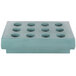 A rectangular slate blue tray with eight holes.