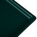 A close-up of a dark green Tablecraft cast aluminum rectangular cooling platter.