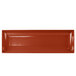 A copper rectangular platter with flared edges.