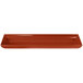 A copper rectangular cast aluminum flared platter with a white background.