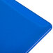 A cobalt blue cast aluminum rectangular cooling platter on a table.