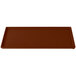 A brown rectangular cast aluminum cooling tray with a handle.