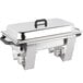 A Vollrath stainless steel rectangular chafer with a lid and tray.
