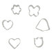 A group of Wilton metal mini cookie cutters in the shapes of hearts, flowers, and butterflies.