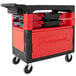 A black Rubbermaid Trades Cart with a black lid and red accents.