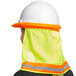 A woman wearing a hard hat with a Cordova lime high visibility neck shade with reflective tape.