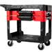 A black Rubbermaid TradeMaster tool cart with drawers and bins.