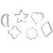 A group of metal Wilton cookie cutters in star and heart shapes.