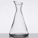 A clear glass Stolzle Pisa carafe on a table.
