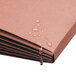 A Smead redrope expansion wallet on a brown surface with water droplets.