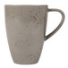 A close-up of the speckled light gray Schonwald porcelain mug and handle.