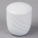 A white ceramic Schonwald Donna pepper shaker.