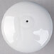 A white round porcelain pepper shaker with a black dot on the top.