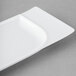 A white rectangular Schonwald porcelain platter with contoured edges.