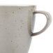 A close up of a Schonwald light gray porcelain coffee cup with a speckled design and a handle.