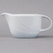A Schonwald white porcelain sauce boat with a curved handle.