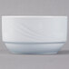 A Schonwald white porcelain bowl with a wavy design on it.