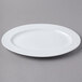 A Schonwald white porcelain oval platter with a rim.