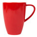 A red Schonwald porcelain coffee mug with a handle.