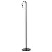 A black powder coated iron wire sign holder pole on a white table.
