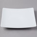 A Schonwald white square porcelain coupe plate with a white rim.
