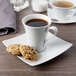 A Schonwald white porcelain saucer with a cup of coffee and cookies.
