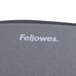 The Fellowes logo on a black mouse pad.
