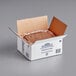 A box of Ghirardelli Sweet Ground Chocolate & Cocoa Powder with a brown powder in it.