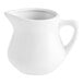 An Acopa bright white porcelain creamer with a handle.