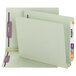 A close-up of a Smead gray/green end tab file folder with purple trim.