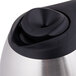 A Bunn stainless steel thermal carafe with a black handle.