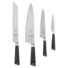 A group of Mercer Culinary Z&#252;M knives with black handles on a white rectangular board.