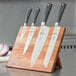 A set of Mercer Culinary Z&#252;M knives on a wooden board