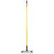 A Rubbermaid HYGEN microfiber mop with a yellow handle.