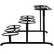 A Libbey black metal 3-tier stand with round wells on a counter in a bakery display.