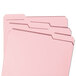 Several Smead pink letter size file folders with reinforced 1/3 cut assorted tabs.