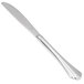 A Libbey stainless steel dinner knife with a fluted solid handle and long blade.