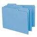 A close-up of three blue Smead file folders with white labels.