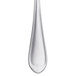 A close-up of a Libbey stainless steel bouillon spoon with a silver border.