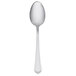 A Libbey stainless steel serving spoon with a white handle.